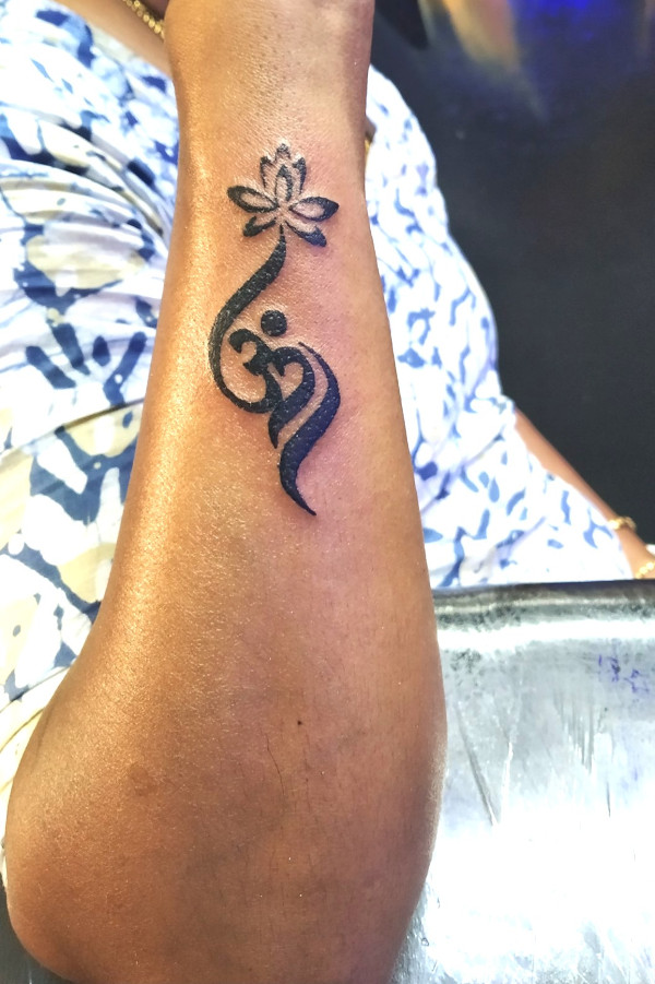 Geetja - Lotus aum tattoo photo
