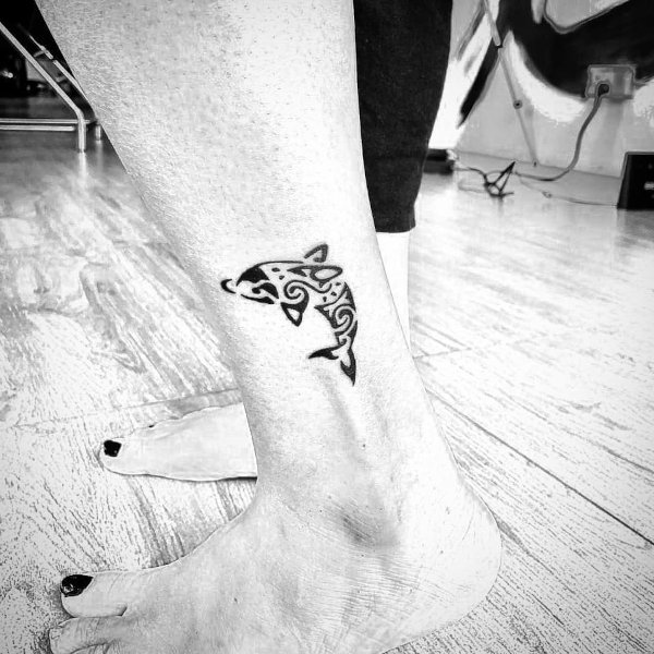 Guest - Dolphin tattoo